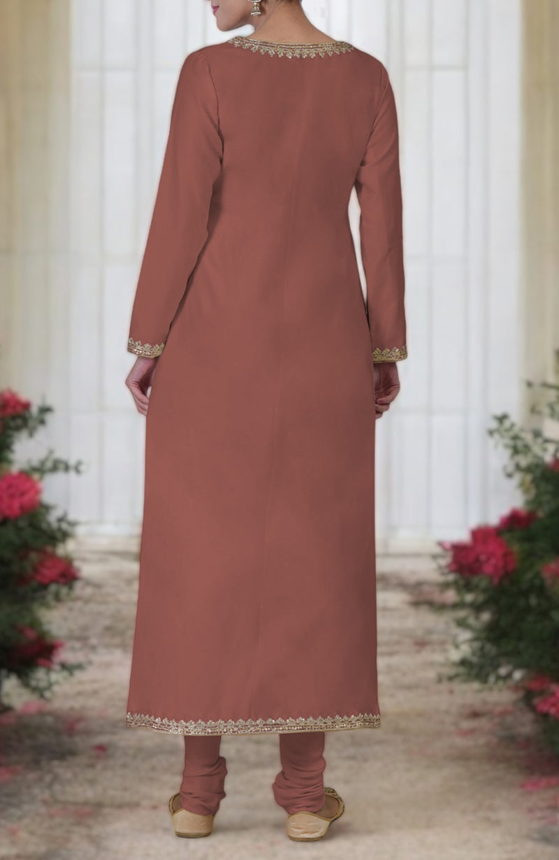 A woman from behind wears a chutney-colored kurta set with gold embroidery.