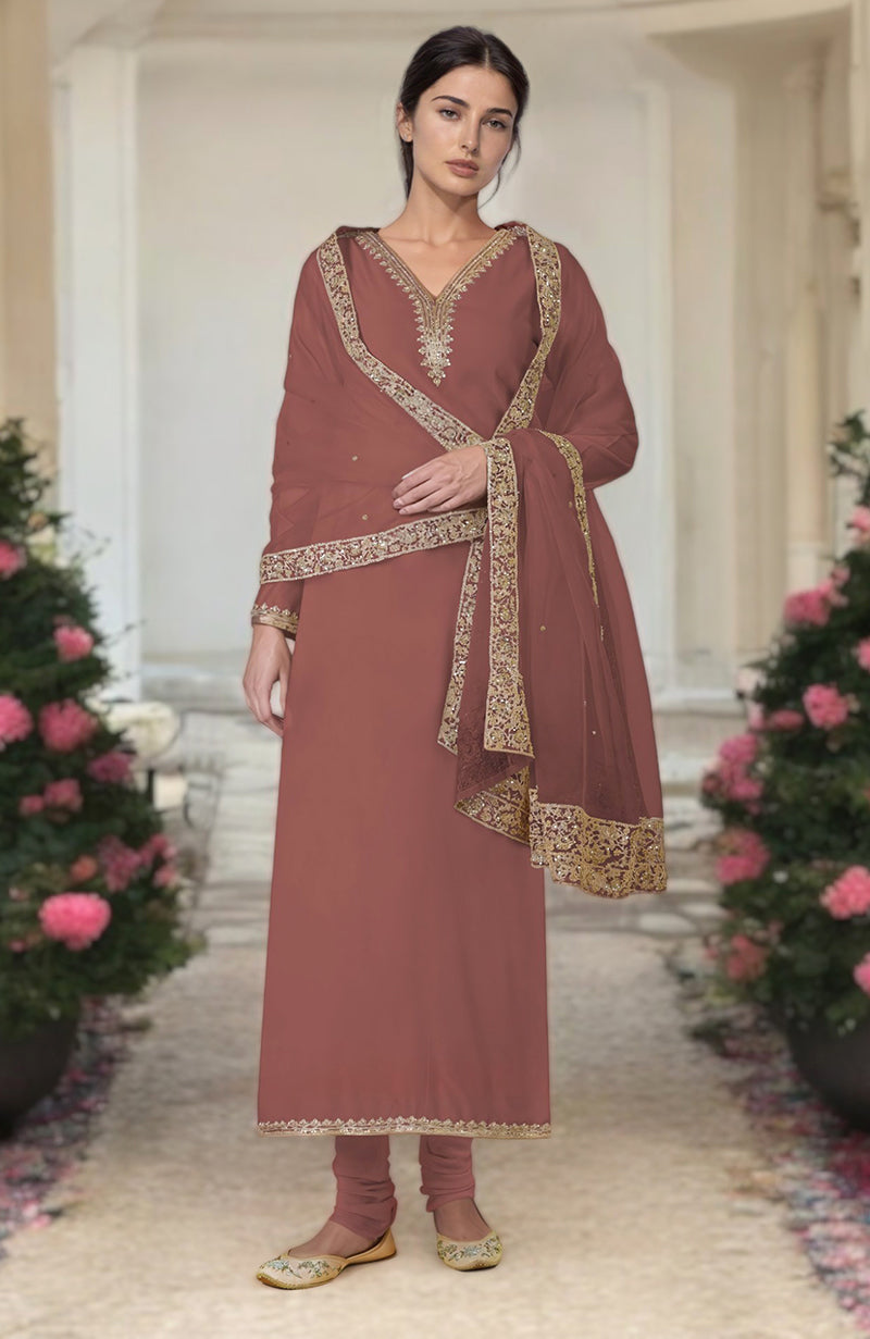 A woman models a chutney-colored kurta set with gold embroidery and a matching dupatta.