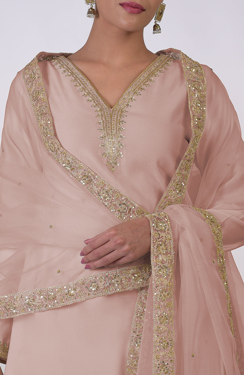 Oyster pink kurta set with gold marori and zardozi hand embroidery.