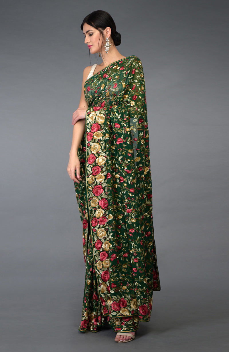 Emerald green Parsi Gara hand embroidered saree with floral borders and jaal.