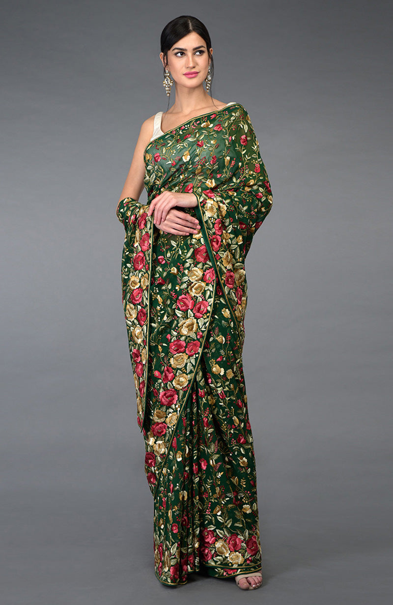 Emerald green Parsi Gara hand embroidered saree with floral borders and jaal.
