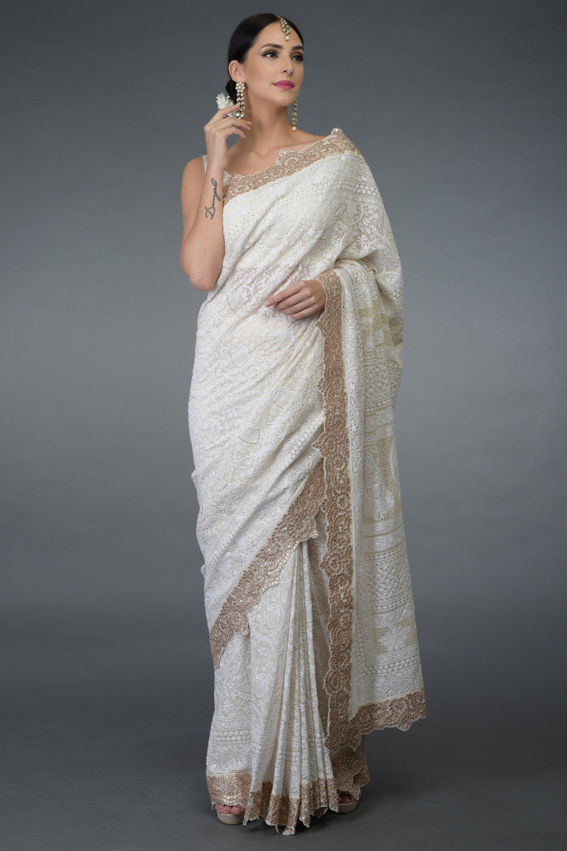 Ivory Georgette saree with hand-embroidered Chikankari, kamdani, and rose gold gota patti borders