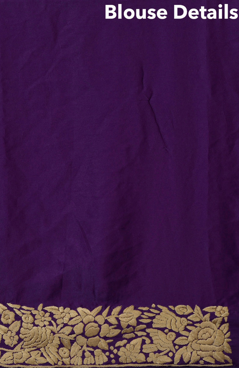 Purple satin silk saree with beige hand embroidered birds and floral Parsi Gara design.