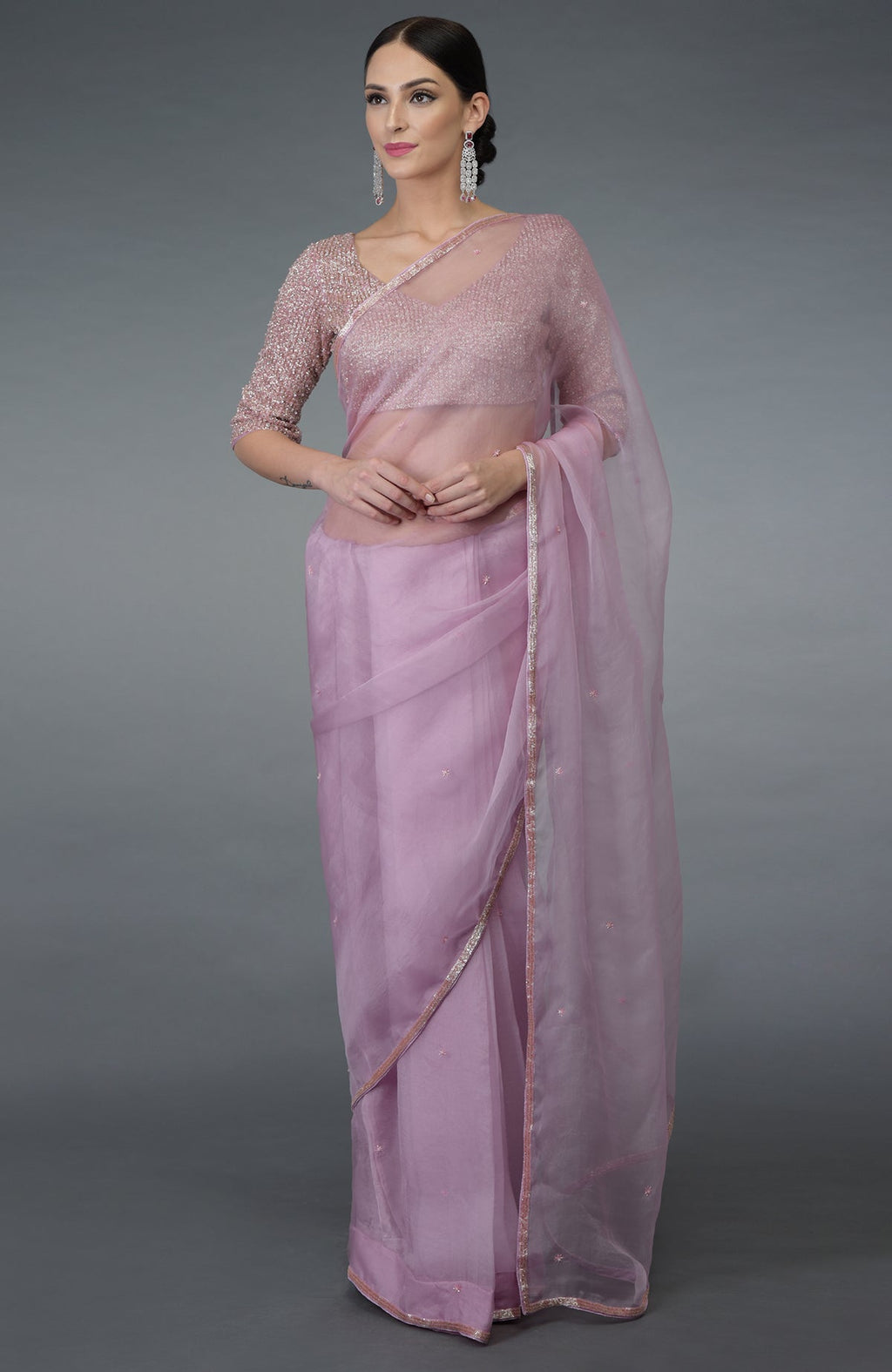 Lilac silk organza saree with a hand-embroidered blouse.