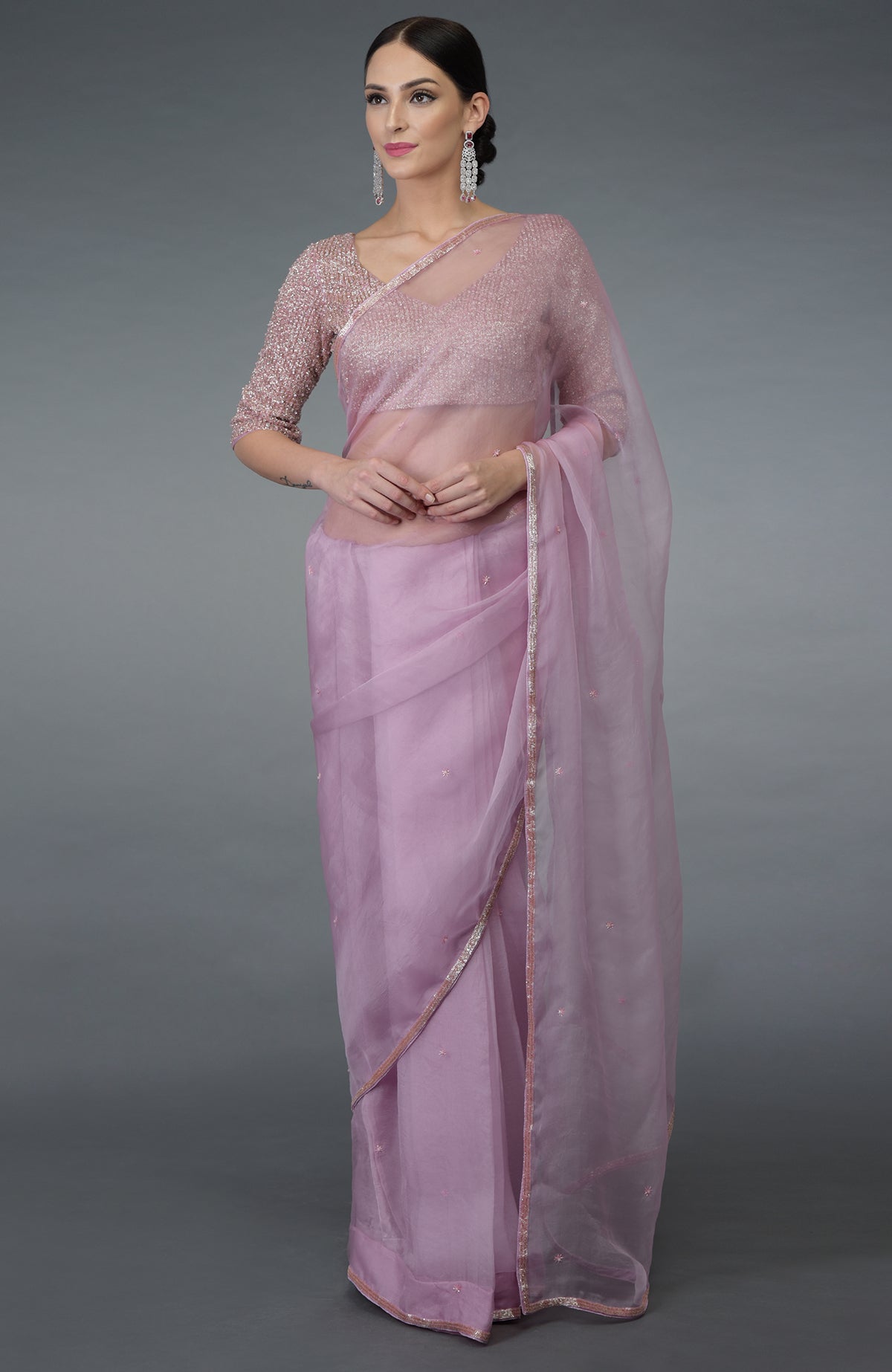 Lilac silk organza saree with a hand-embroidered blouse.