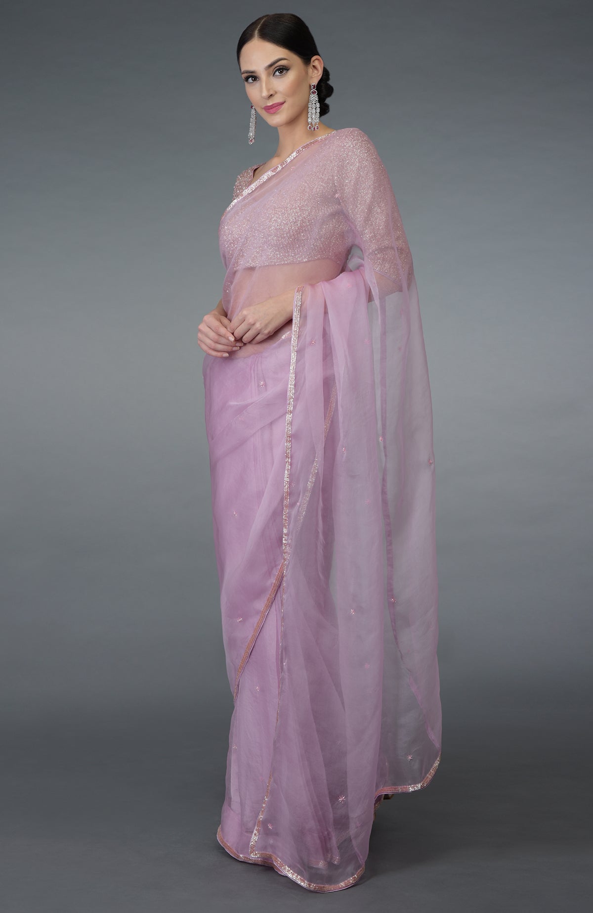 Lilac silk organza saree with hand-embroidered borders and a matching blouse.