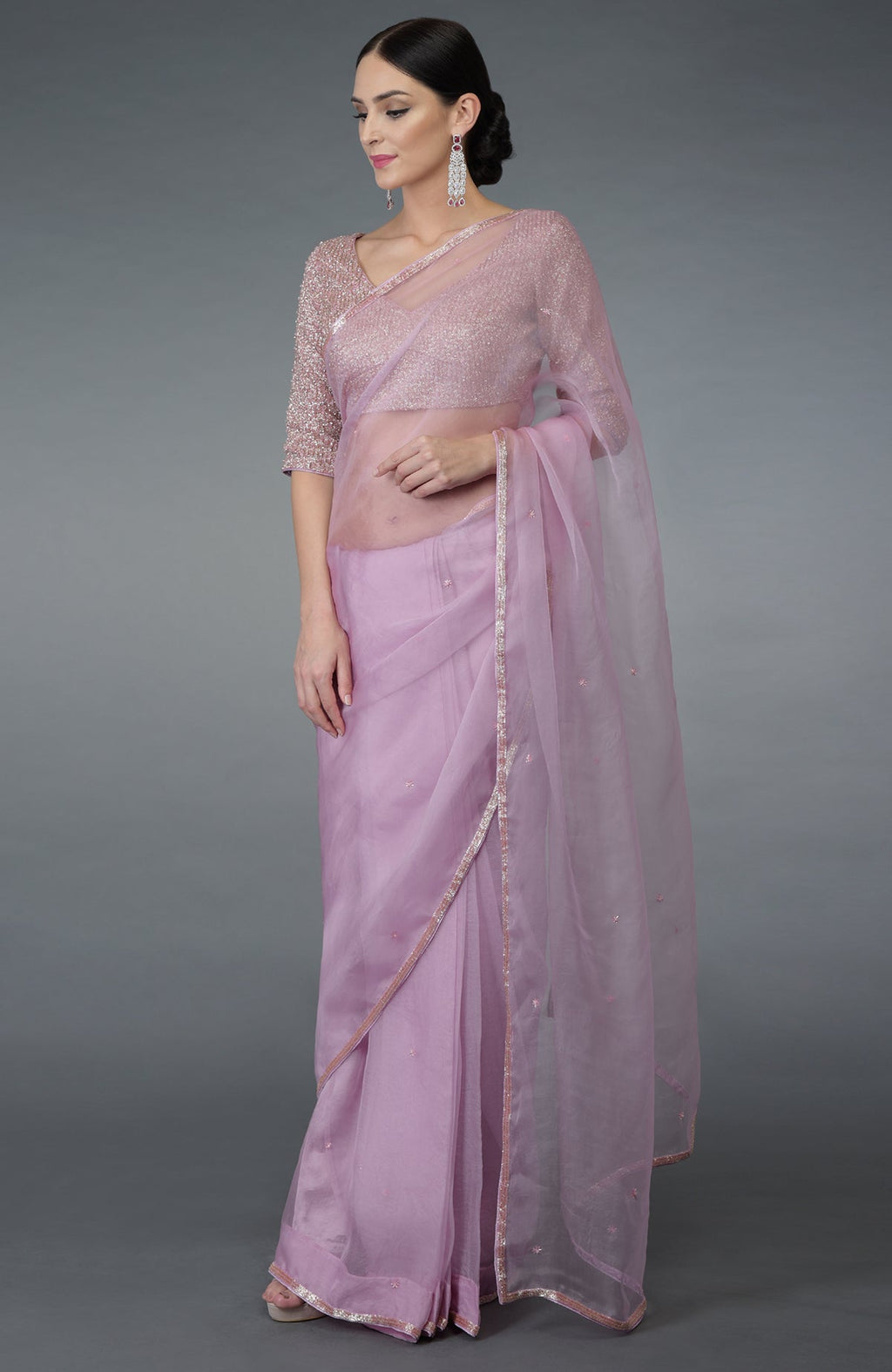 Lilac silk organza saree with a matching embroidered blouse.