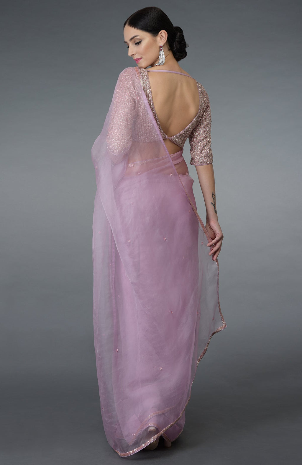Lilac silk organza saree with a hand-embroidered blouse.