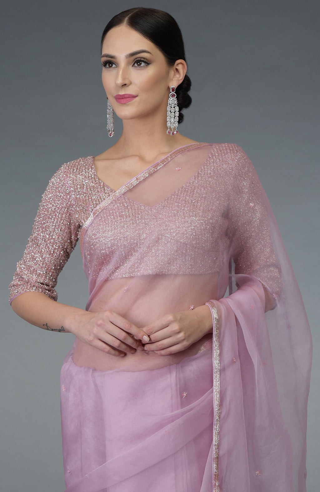 Lilac silk organza saree with a hand-embroidered blouse and statement earrings.