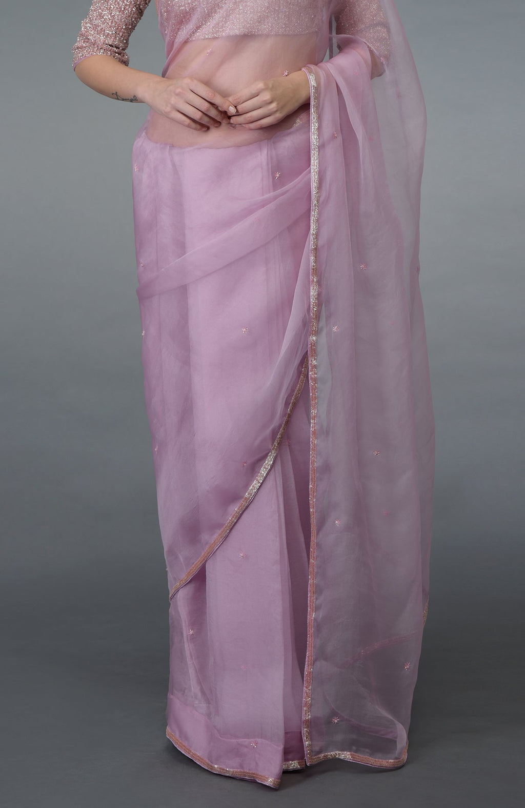 Lilac silk organza saree with a matching embroidered blouse.