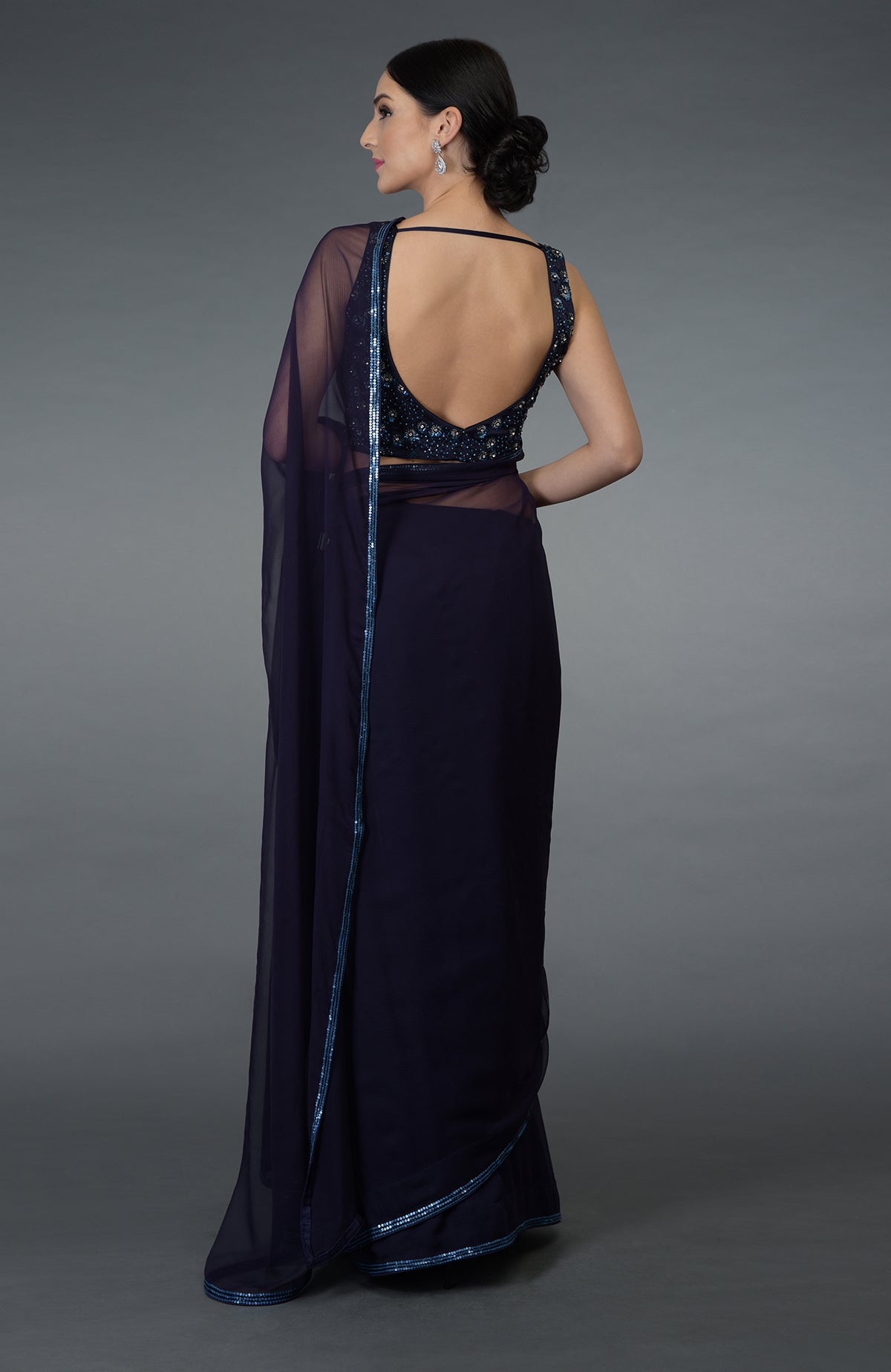 Eclipse blue crystal sequin and beads work saree with a deep back blouse.