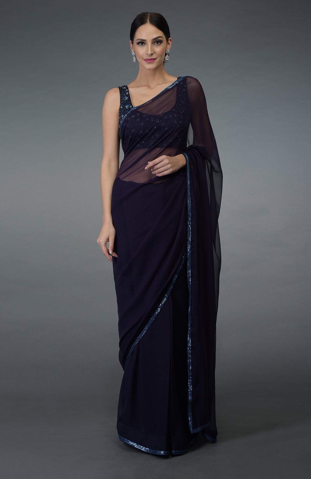 Eclipse blue chiffon saree with sequin and bead embroidered borders and a matching blouse.