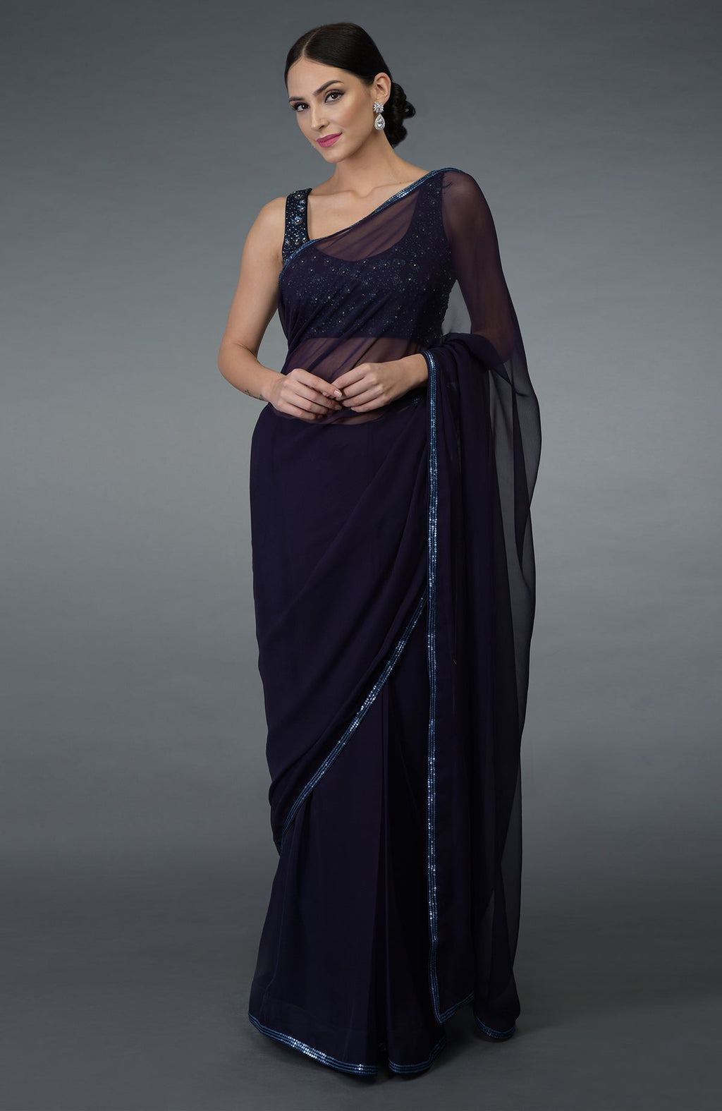Eclipse blue chiffon saree with sequin, beads, and crystal hand-embroidered borders.
