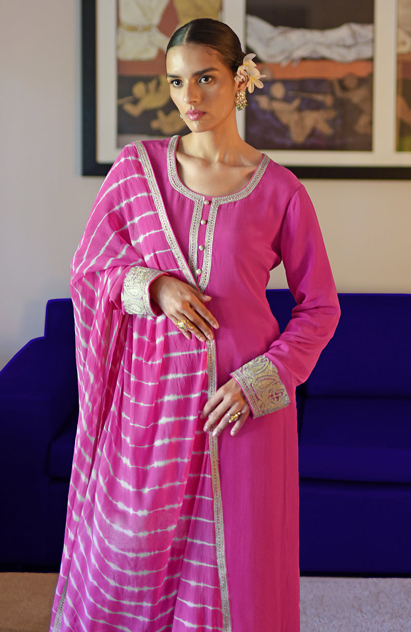 Pink kurta set with silver Kashmiri tilla embroidery and a leheriya dupatta.