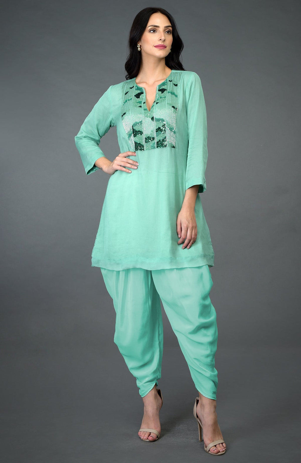 Mint green sequin and beads embroidered dhoti pants suit on a model.
