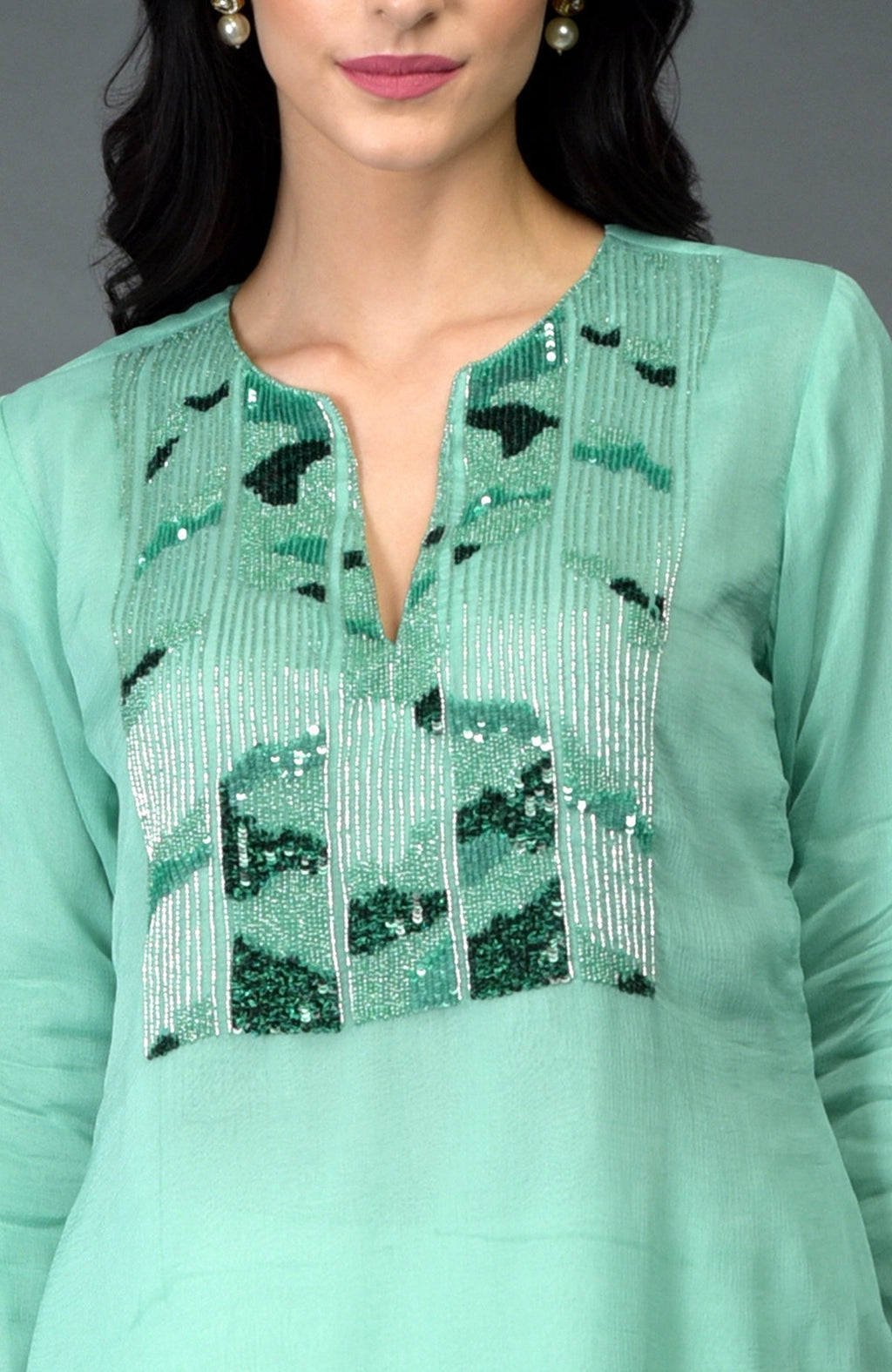 Mint green sequin and beads embroidered dhoti pants suit with a V-neck.