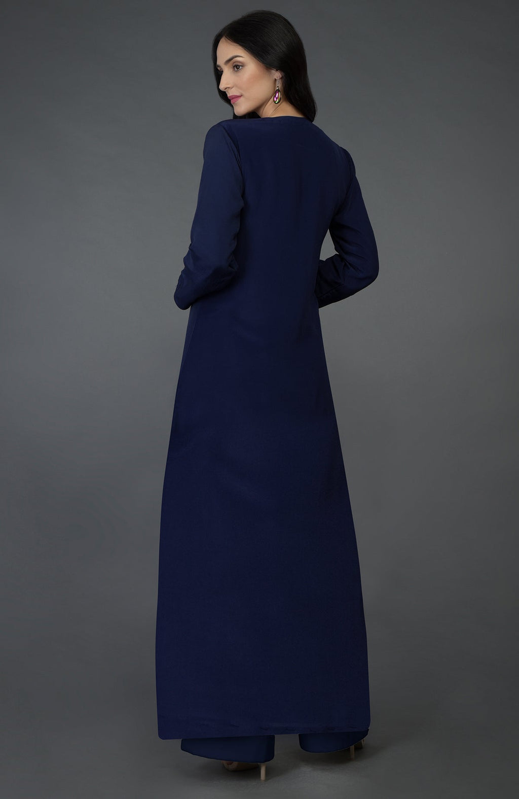 A woman in an eclipse blue resham sequin and beads embroidered kurta set.