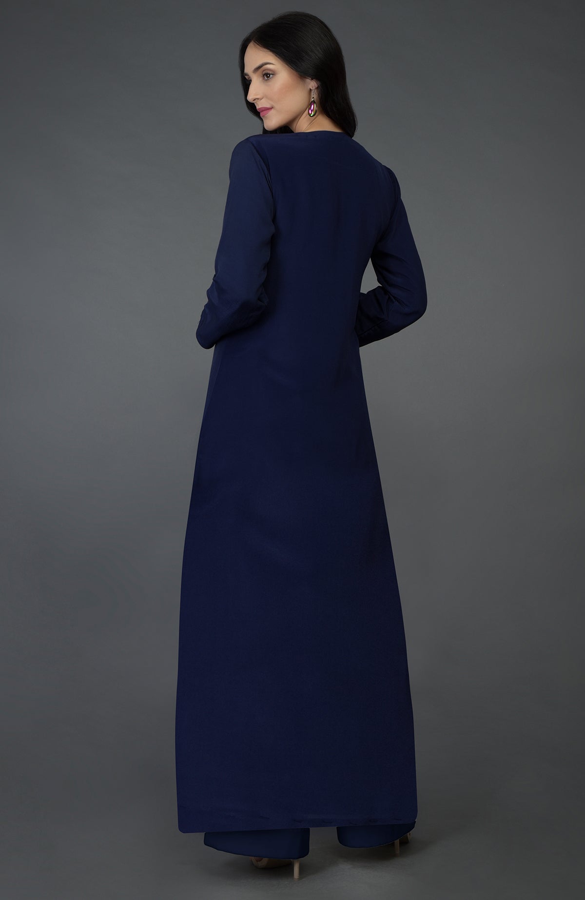 A woman in an eclipse blue resham sequin and beads embroidered kurta set.