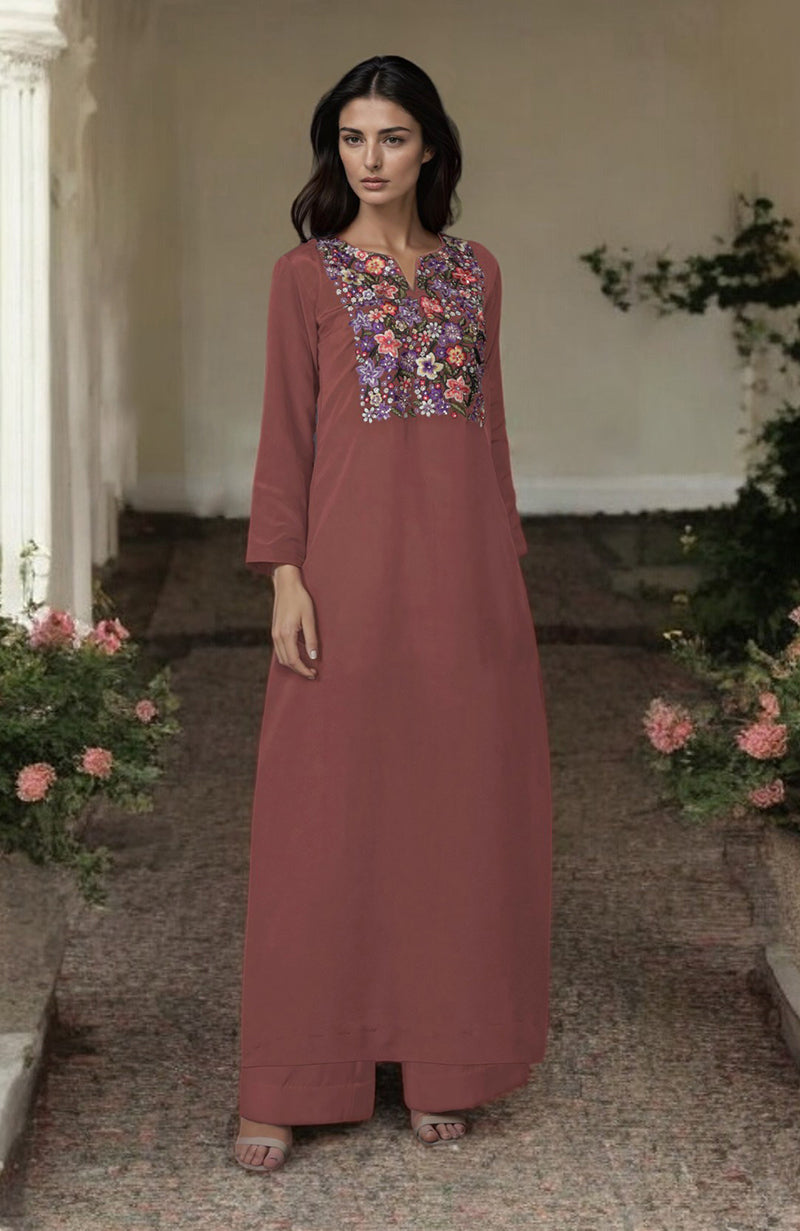 A woman models a chutney-colored kurta set with floral embroidery on the yoke.