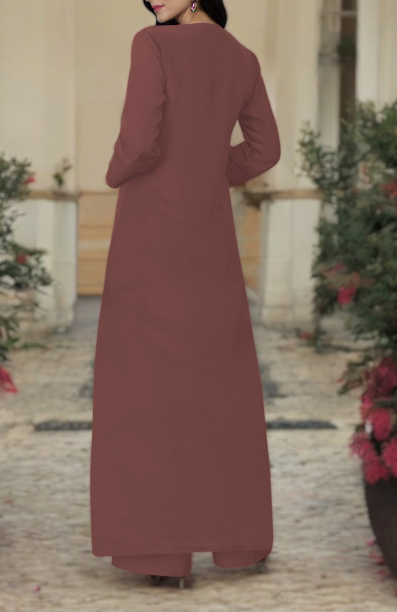 A woman from behind wears a long, chutney-colored kurta set with embroidered details.