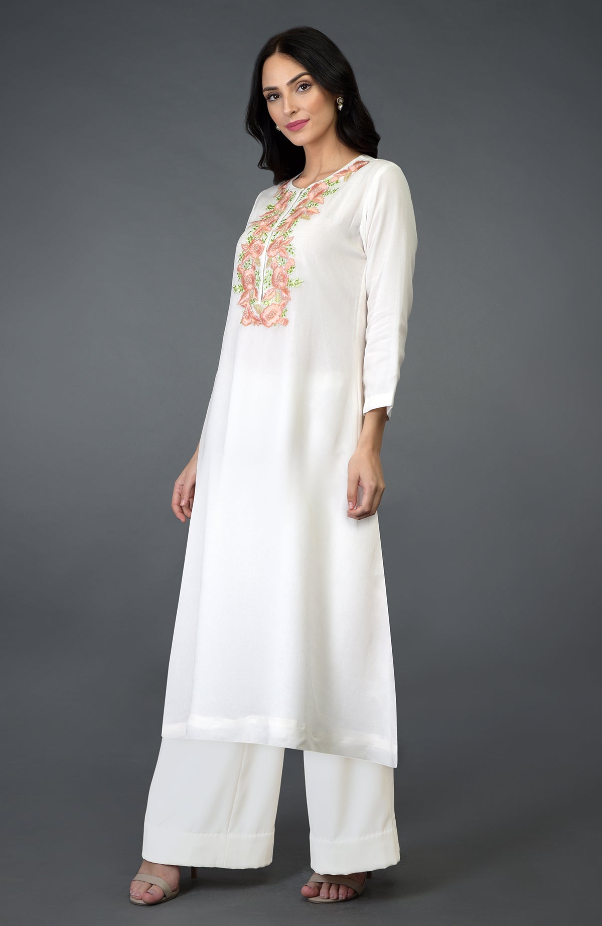Ivory kurta set with floral resham, sequin, and bead embroidery on the yoke.