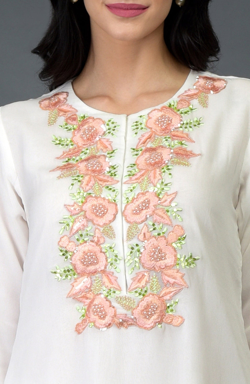 Ivory kurta with peach and green floral embroidery, sequins, and beads.