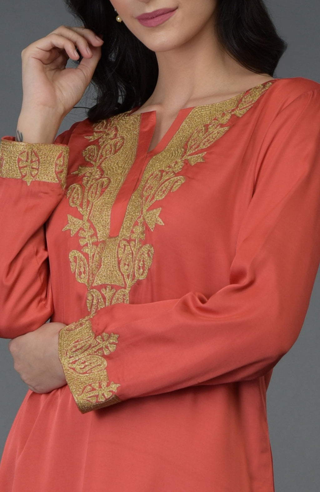 Living coral Kashmiri tilla embroidered dhoti pants suit with gold embroidery.