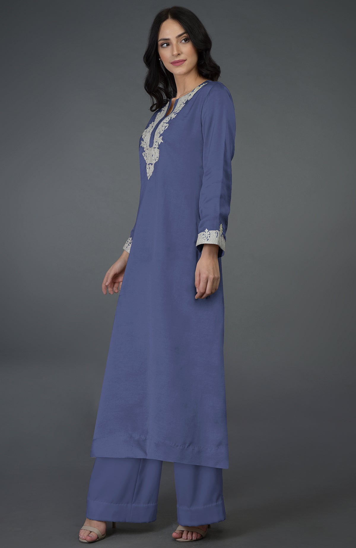An iris blue Kashmiri tilla embroidered kurta set with a long tunic and wide-leg pants.