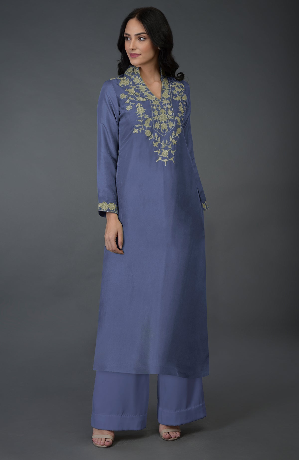 An iris blue Kashmiri tilla embroidered kurta set with a long tunic and wide-leg pants.