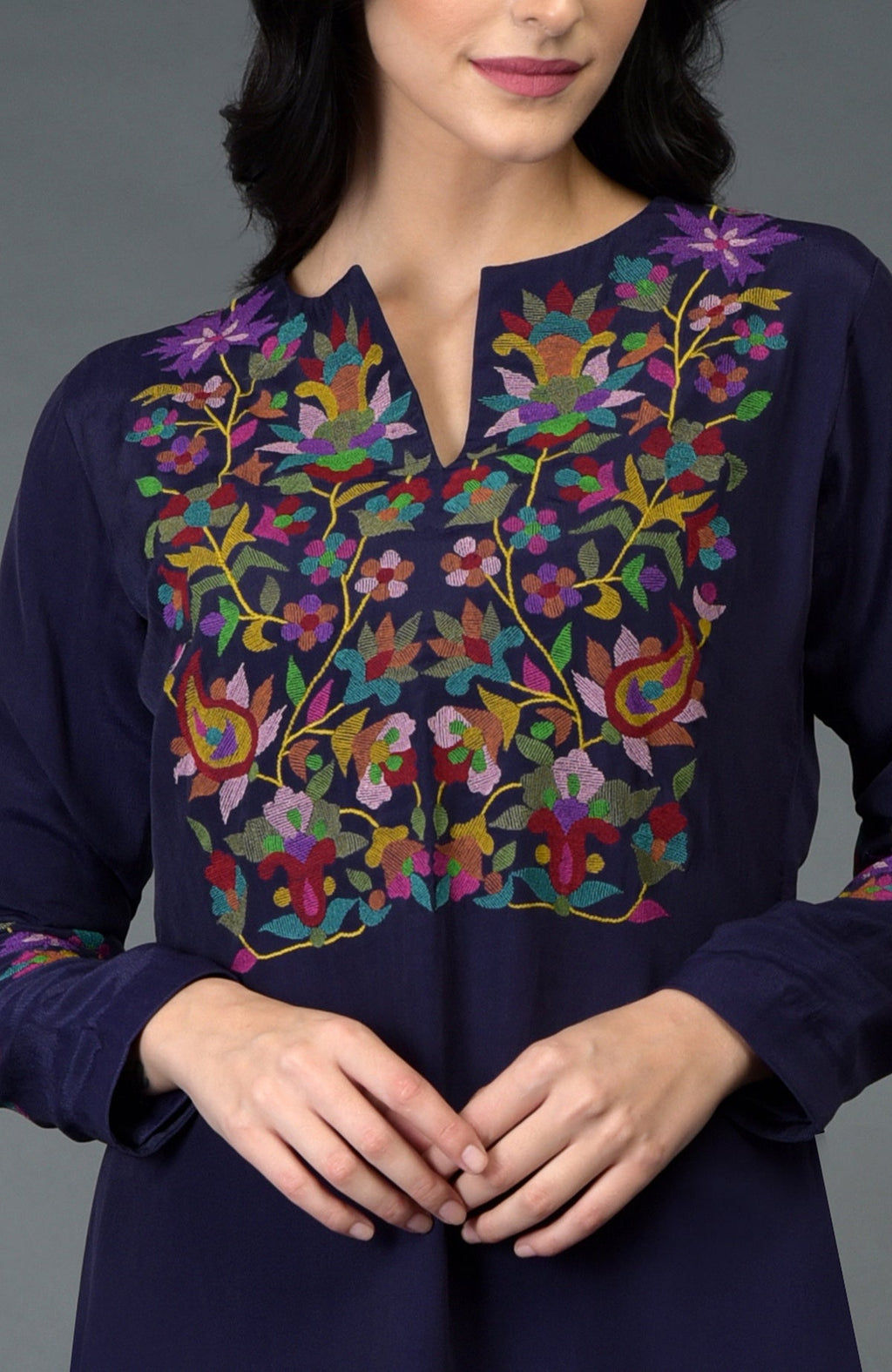 An Eclipse Blue Kani Art Embroidered Kurta Set with vibrant floral embroidery.