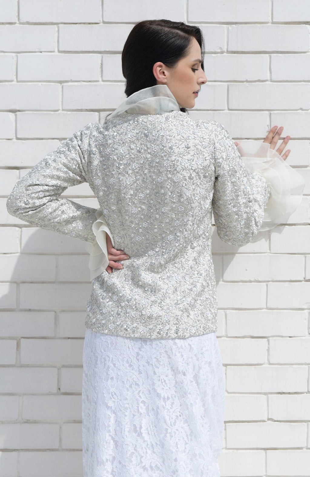 White frost sequin and French wire hand-embroidered jacket with a white lace skirt.