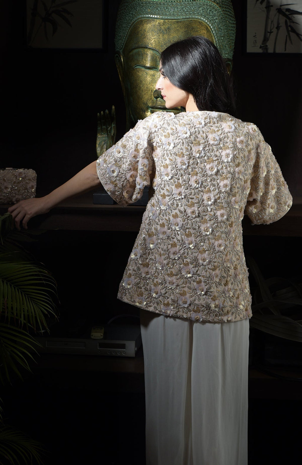 Light peach sequin and bead hand-embroidered peplum jacket with 3D flowers.