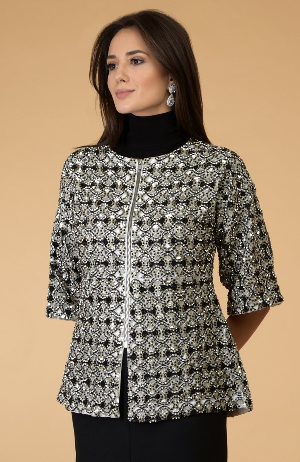 Black and silver sequined and beaded jacket with a zipper closure.