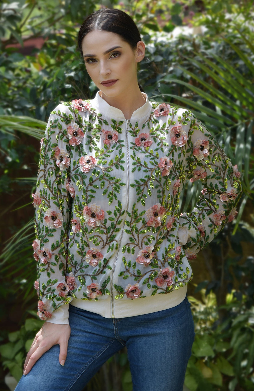 A cream silk chiffon bomber jacket with coral 3D florals and beaded leaves.