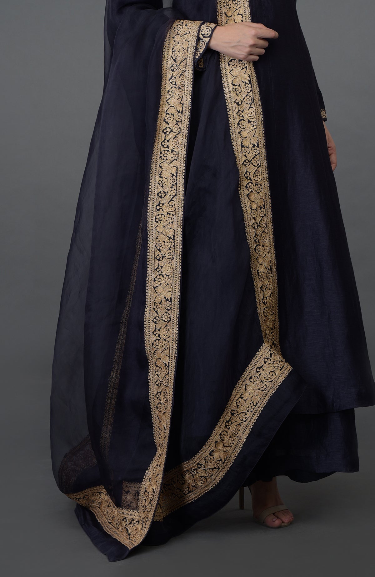 Eclipse blue suit with gold tilla embroidery on the kurta and dupatta.