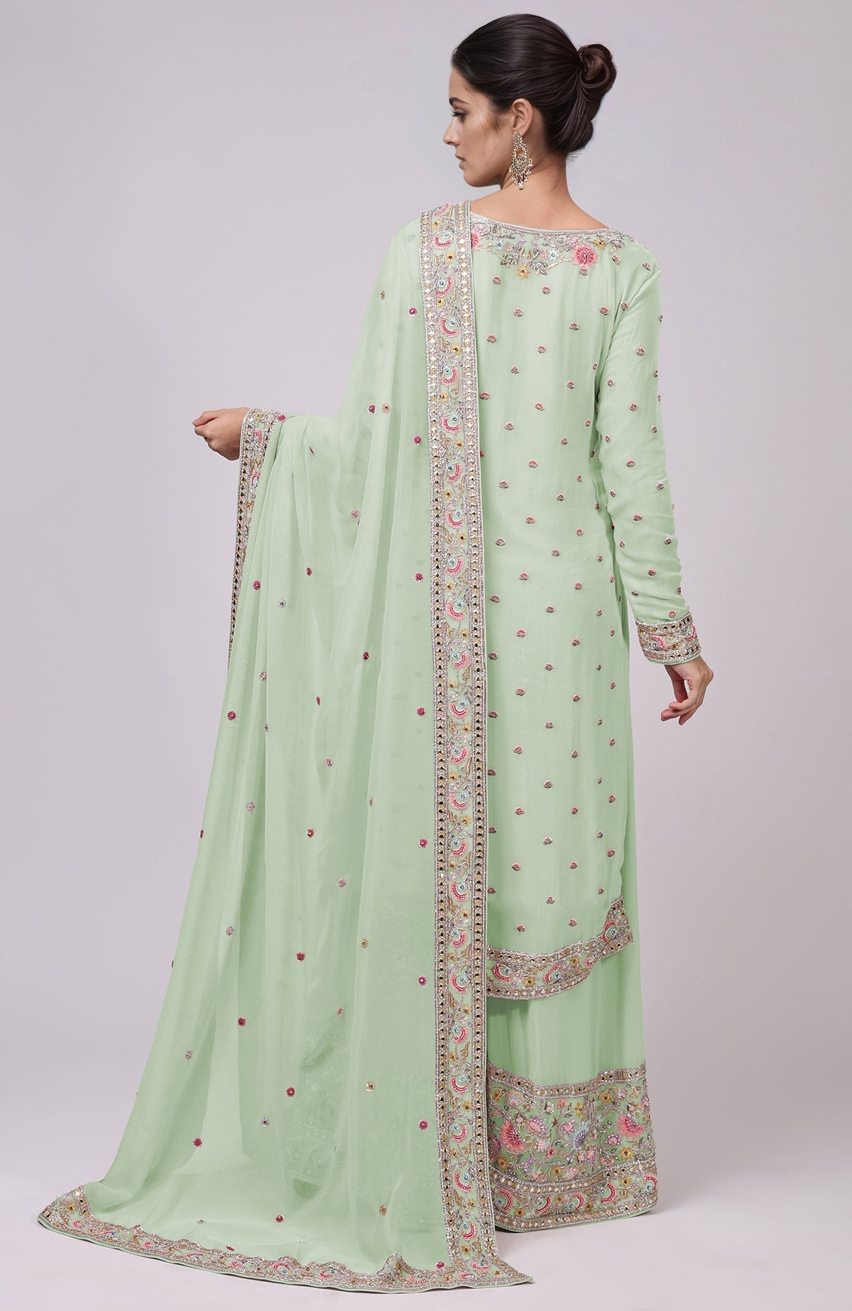 Sage green sharara set with intricate resham, zardozi, bead, and mirror embroidery.