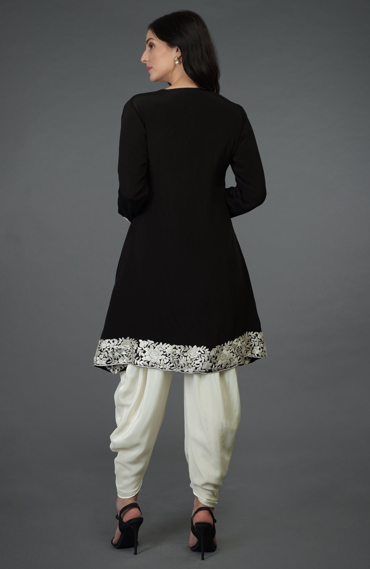 Black kurta with ivory Parsi Gara embroidery paired with ivory cowl Patiala pants.