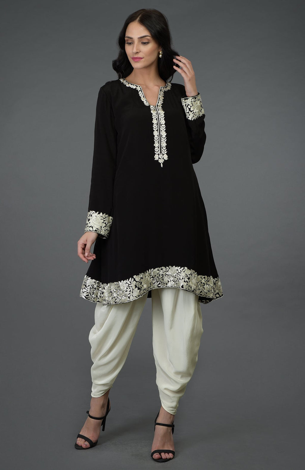 Black kurta with ivory Parsi Gara embroidery paired with ivory cowl Patiala pants.