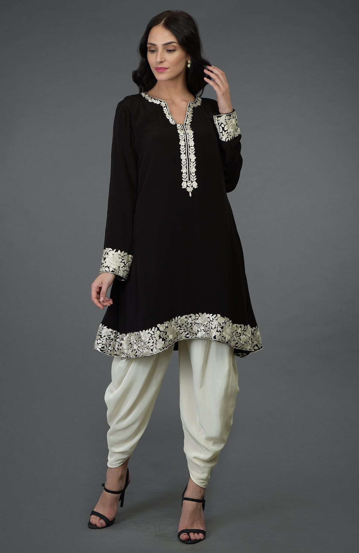 Black kurta with ivory Parsi Gara embroidery paired with ivory cowl Patiala pants.