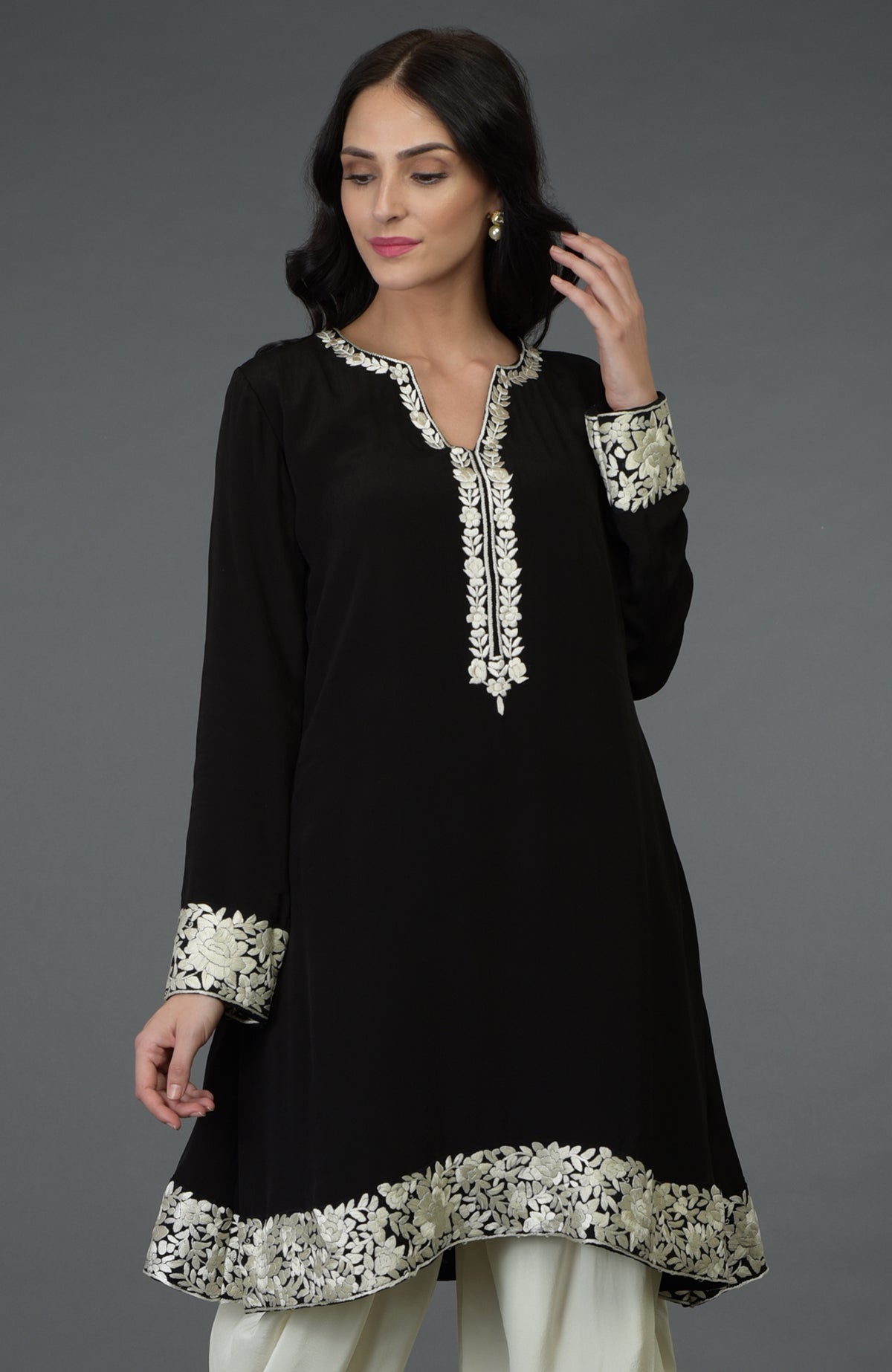 Black kurta with ivory Parsi Gara embroidery paired with ivory cowl Patiala pants.