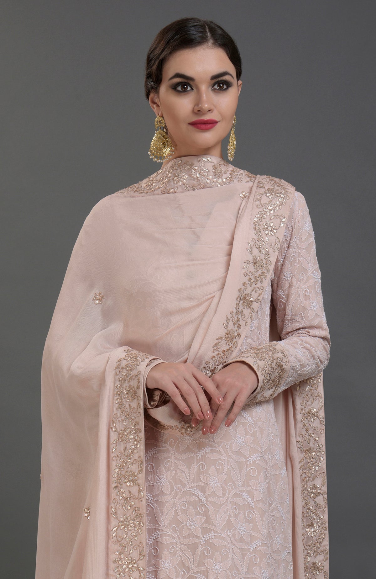 Oyster pink chikankari and gota patti hand-embroidered kurta set.
