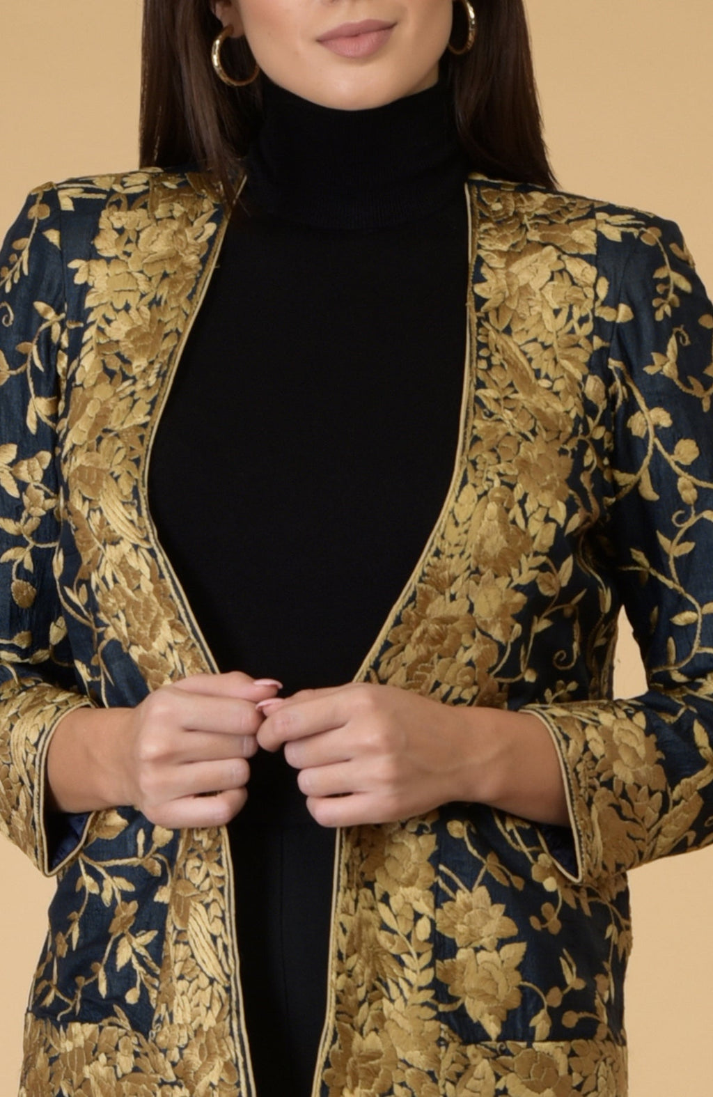 Midnight blue Parsi Gara embroidered shrug jacket with gold floral and bird patterns.