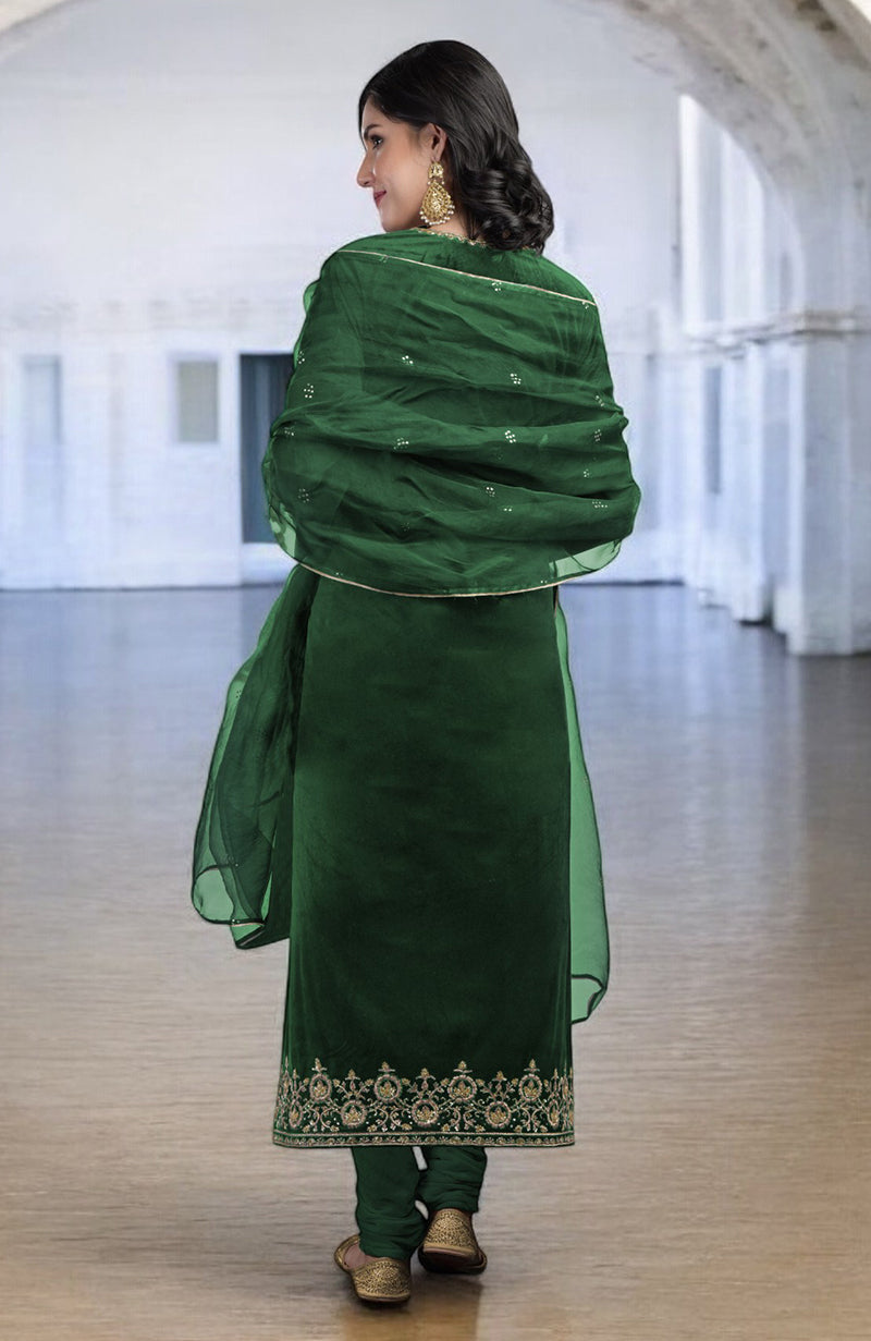 Emerald green velvet kurta set with gold zardozi embroidery and an organza dupatta.