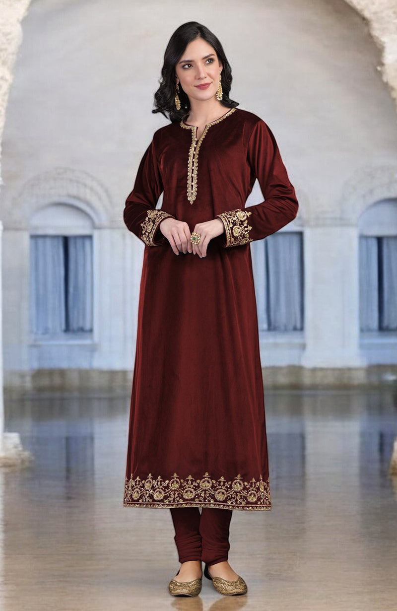 Maroon velvet kurta set with gold zardozi embroidery on sleeves, placket, and hem.