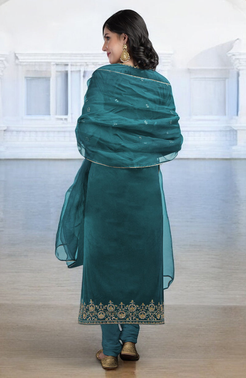 Peacock blue kurta set with zardozi embroidery and an organza dupatta.