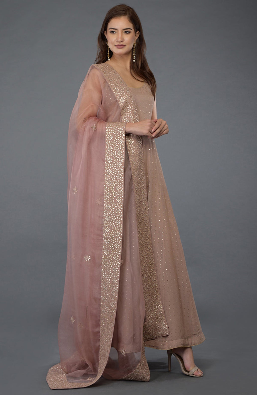 Dusky pink Anarkali suit with a gold dot embossed georgette and embroidered dupatta.