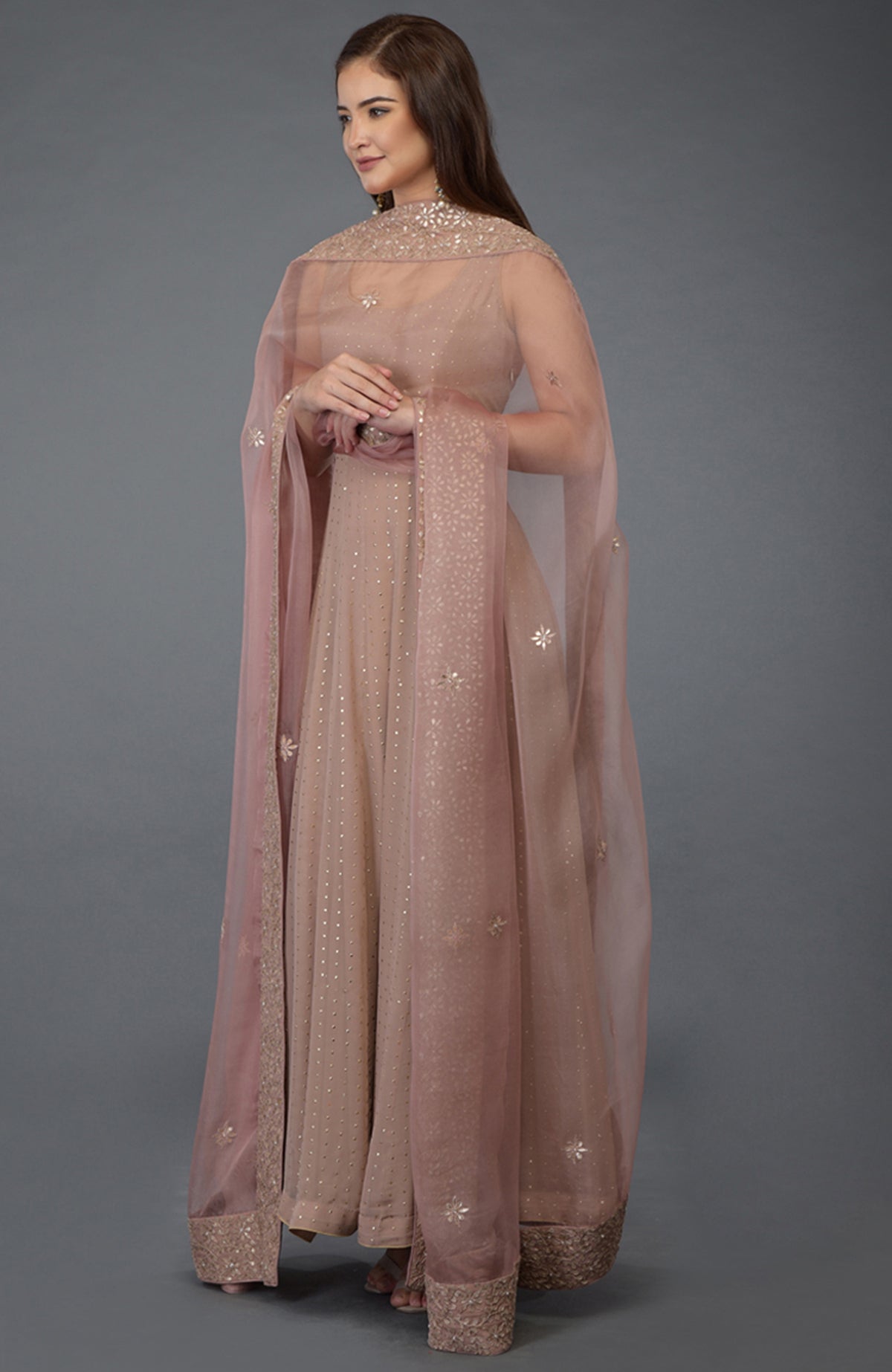 Dusky pink Anarkali suit with gold dot embossing and a matching embroidered dupatta.