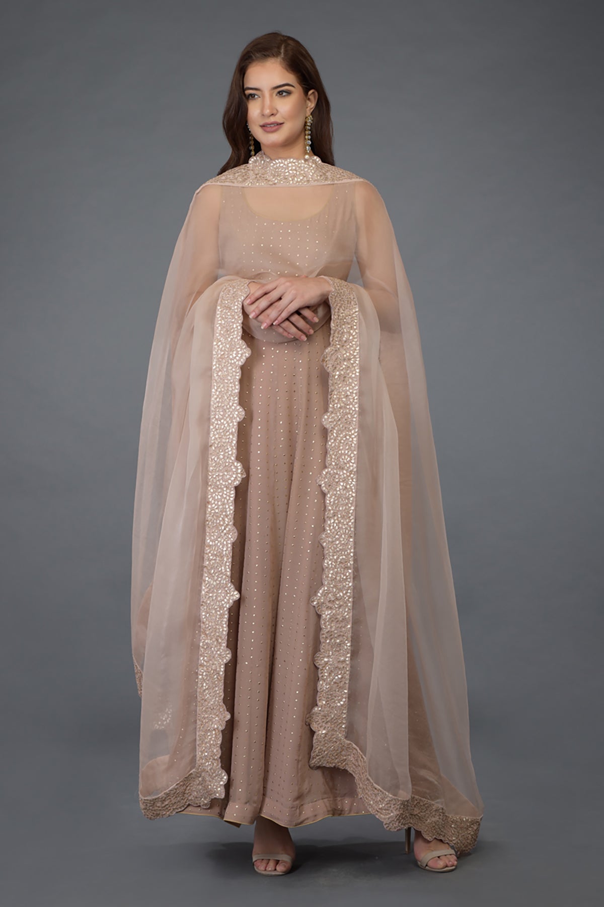 Oyster pink Anarkali suit with gold dot embossing and a matching gota patti dupatta.