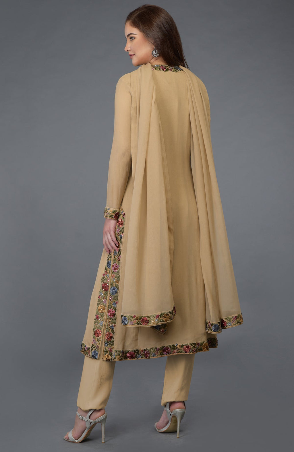 Beige Parsi Gara embroidered overlay suit with floral borders and sequin embellishments.