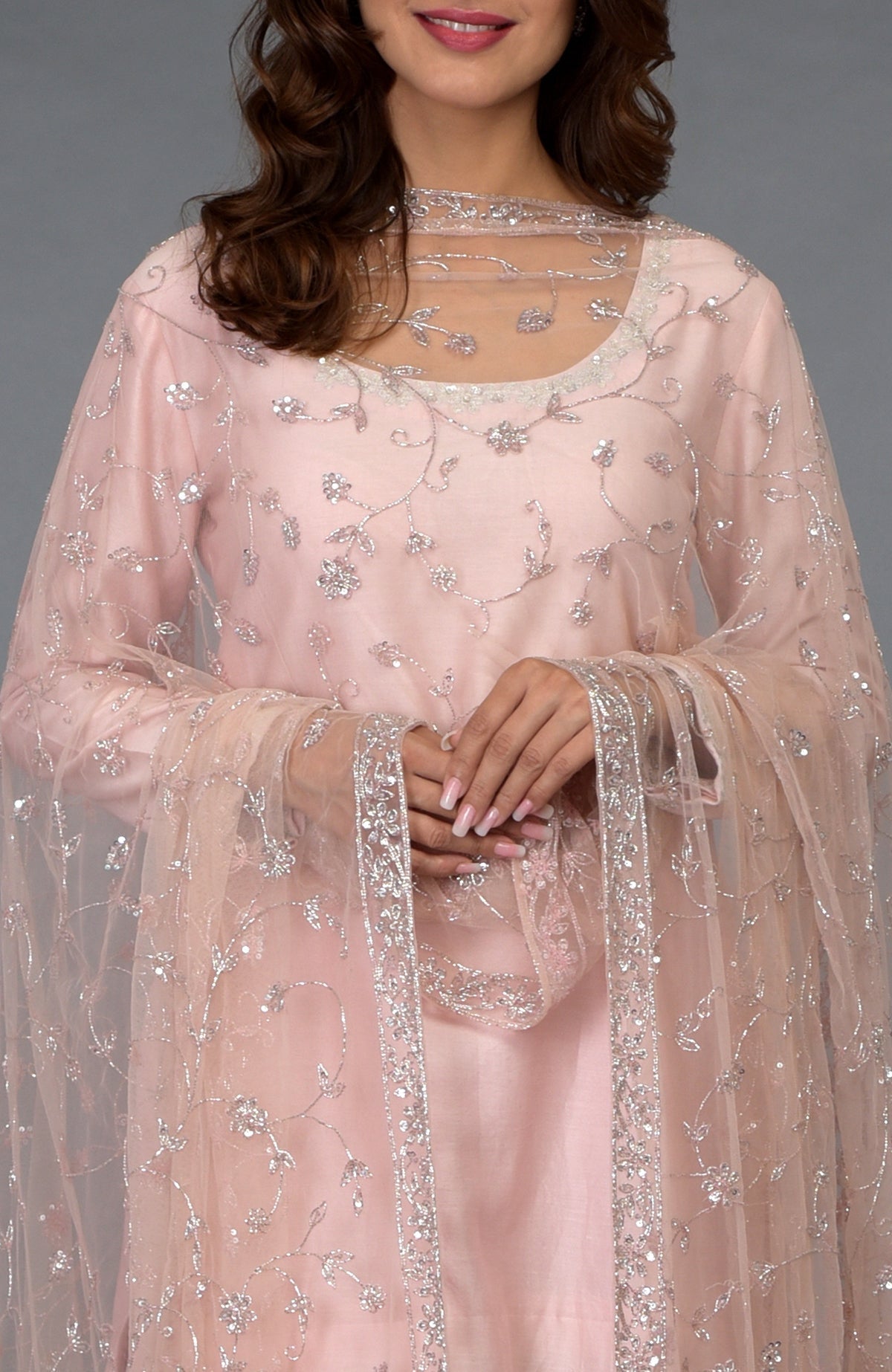 Pink-silver gharara suit with zari, sequin, and crystal embroidery.